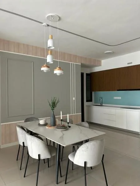 Dining features: marble dining table, 6 upholstered dining chairs in light grey, pendant lighting with multiple bulbs, decorative vase with greenery, candles on the table, grey accent wall, wood paneling, kitchen cabinetry in dark wood, kitchen countertop in white, blue backsplash, floor-to-ceiling windows, neutral tile flooring; style: modern. Kitchen features: white cabinetry, blue backsplash, kitchen countertop in white, built-in sink, built-in appliances, neutral tile flooring; style: modern.