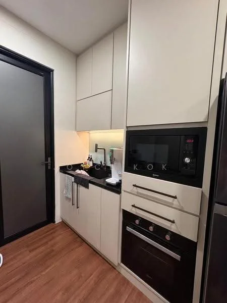 Kitchen features: white cabinetry, black countertop, built-in microwave, built-in oven, freestanding range oven, stainless-steel fridge, under-cabinet lighting, wood laminate flooring, single-bowl stainless-steel sink, chrome pull-down faucet; style: modern.