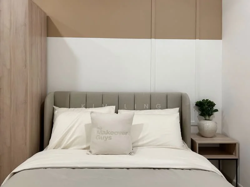 Bedroom features: king-size bed with upholstered headboard, neutral bedding, decorative throw pillow, wooden bedside table, potted plant on bedside table, light-colored walls with two-tone paint, wooden wardrobe, soft lighting; style: modern.