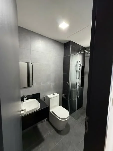 Bathroom features: grey tiled walls, black tiled accent wall, single-sink vanity with dark cabinetry, round mirror, chrome basin mixer faucet, one-piece toilet, walk-in shower with glass enclosure, rain shower head, handheld shower, recessed ceiling lights, slate grey floor tiles; style: modern.