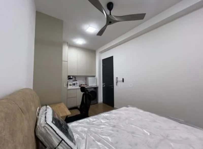 Bedroom features: queen-size bed, upholstered headboard, wooden flooring, ceiling fan, built-in wardrobe, desk with chair, refrigerator, kitchenette with cabinets, wall-mounted light fixtures, neutral painted walls, window with blinds; style: modern.