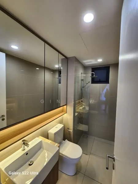 Bathroom features: single-sink vanity with wood cabinet, white countertop, chrome basin mixer, framed mirror, one-piece toilet, walk-in shower with glass enclosure, rain shower head, tile cladding on walls, ceramic tile flooring, recessed LED downlights, exhaust fan, window for natural light; style: modern.