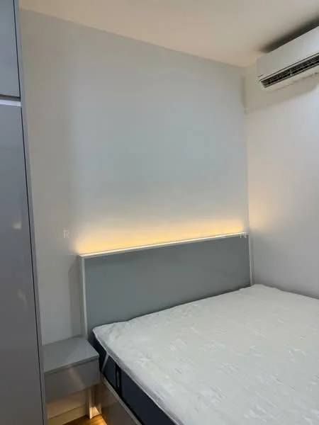 Bedroom features: grey upholstered headboard, white walls, recessed LED lighting, wall-mounted split AC, built-in wardrobe with grey finish, nightstand with drawer, queen-size bed, light-colored bedding; style: modern.