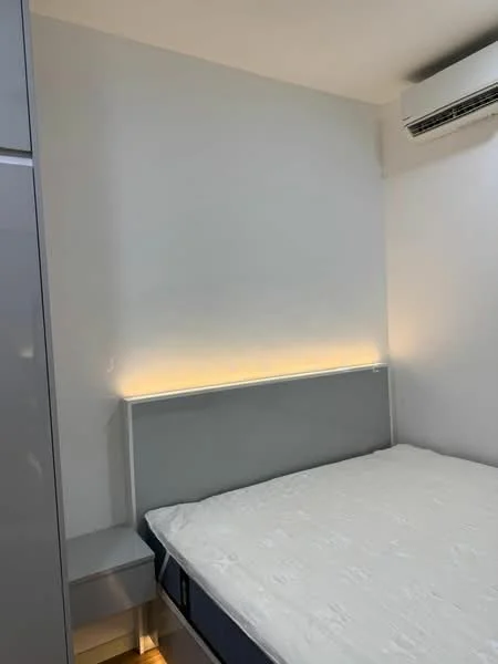Bedroom features: white painted walls, queen-size bed, upholstered headboard, built-in wardrobe, nightstand, recessed LED strip lighting, wall-mounted split AC; style: modern.