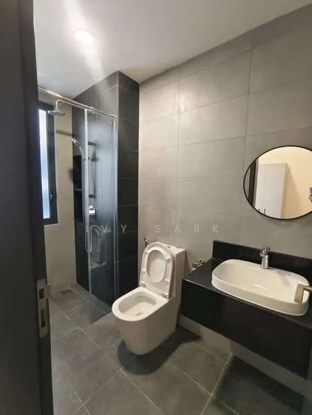 Bathroom features: grey tiled walls, black accent wall, glass shower enclosure, rain shower head, handheld shower, single-sink vanity with black countertop, round mirror, one-piece toilet, tile flooring, recessed lighting; style: modern.