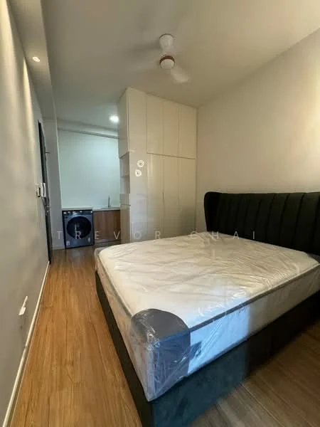 Bedroom features: queen-size bed, upholstered headboard, wooden flooring, ceiling fan, built-in wardrobe, wall-mounted light fixtures, neutral wall color, window with natural light; style: modern. Kitchen features: kitchenette, stainless-steel sink, built-in cabinets, countertop, washing machine, refrigerator; style: modern.