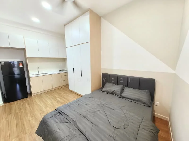Bedroom features: queen-size bed with grey bedding, wooden flooring, white painted walls, sliding wardrobe with white doors, kitchenette with white cabinets, stainless-steel sink, black refrigerator, ceiling fan, countertop with backsplash; style: modern.