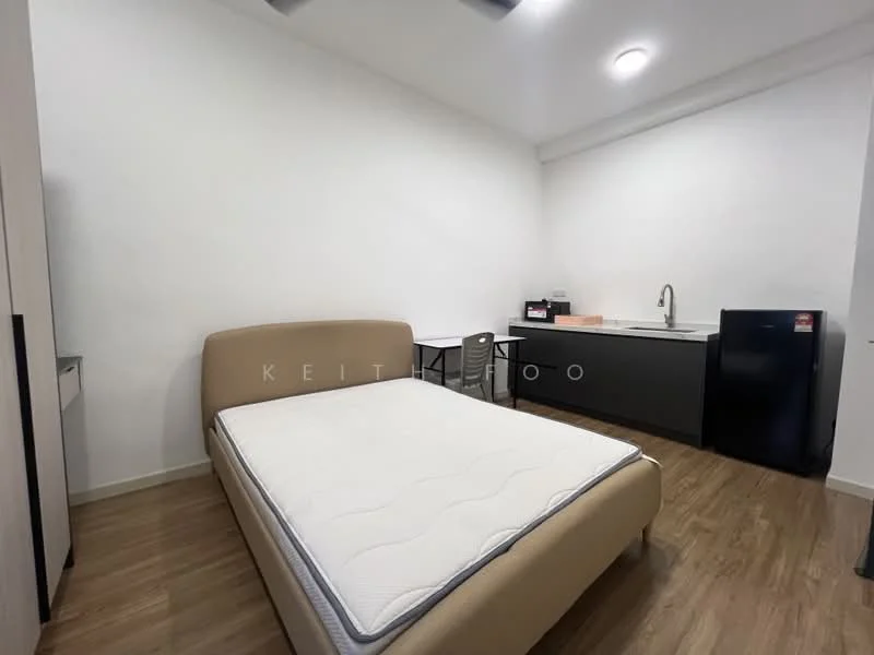 Bedroom features: queen-size bed, mattress, wooden flooring, white painted walls, ceiling fan, desk with chair, kitchenette with sink, black refrigerator; style: modern.