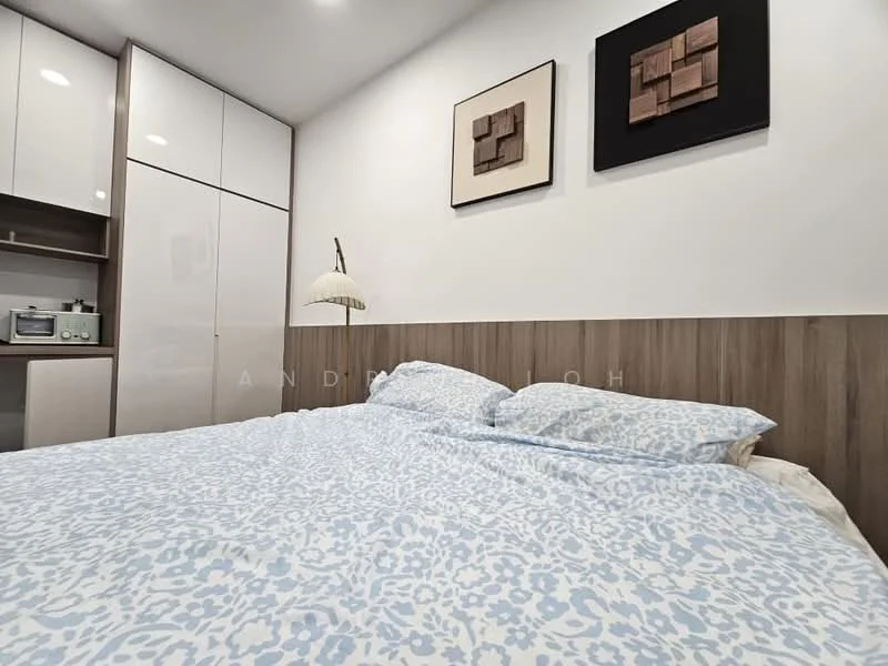 Bedroom features: king-size bed with blue patterned bedding, wooden headboard, white painted walls, built-in wardrobe with glossy white finish, decorative wall art, table lamp with curved shade, shelf with decorative items, recessed lighting; style: modern.