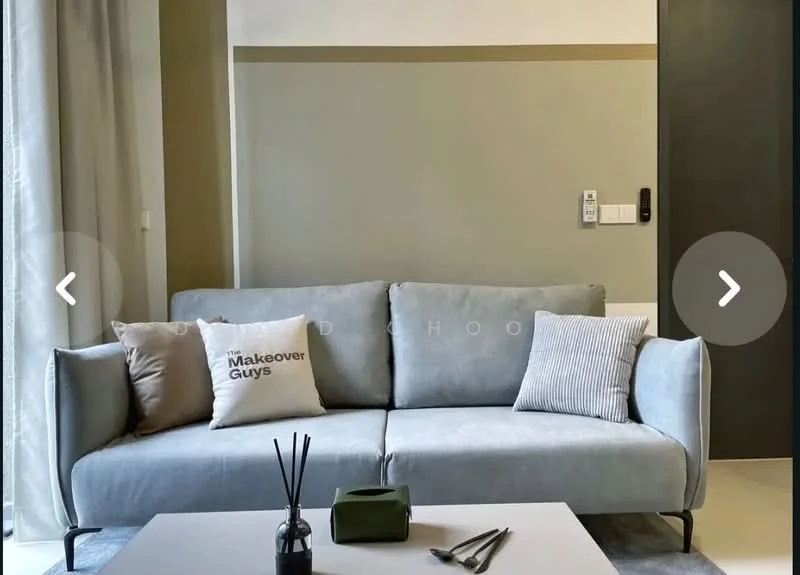 Living features: light grey fabric sofa, decorative cushions with text, coffee table, decorative vase with sticks, green decorative box, floor-to-ceiling windows with sheer curtains, neutral wall color, accent wall in olive green, wall-mounted control panel, minimalist decor; style: modern.