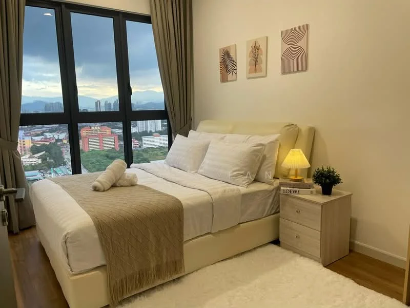 Bedroom features: king-size bed with upholstered headboard, white bedding with decorative pillows, bedside table with lamp, framed artwork on walls, floor-to-ceiling windows, curtains, wooden flooring, area rug, decorative plant on bedside table, towels rolled on bed; style: modern; view: city.