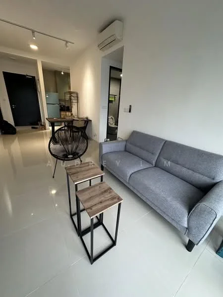 Living features: grey fabric 3-seater sofa, 2 wooden side tables with metal frames, white tiled flooring, recessed ceiling lights, wall-mounted split AC, black accent chair, open layout, neutral wall colour; style: modern.