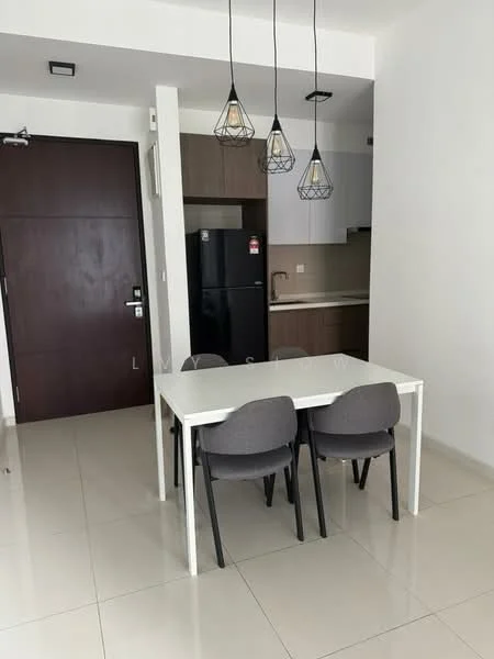 Dining features: white dining table, 2 grey upholstered dining chairs, black refrigerator, wood cabinetry, white countertop, recessed ceiling lights, hanging pendant lights, cream tiled flooring, white painted walls, door leading to hallway; style: modern.