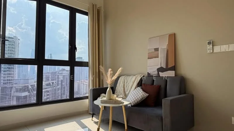 Living features: grey fabric sofa, decorative cushions in various colors, round coffee table with a light wood finish, framed artwork on the wall, floor-to-ceiling windows, sheer curtains, city skyline view, light-colored painted walls, tile flooring; style: modern; view: city.