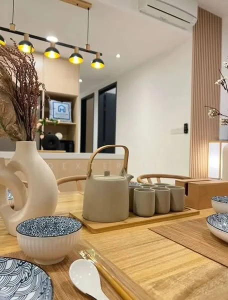 Dining features: wooden dining table, ceramic dinnerware with blue patterns, ceramic teapot, ceramic cups, wooden chopsticks, decorative vase with dried flowers, pendant lighting with multiple bulbs, wall-mounted shelving unit, air conditioning unit, neutral wall color, wood panel accent wall; style: modern.