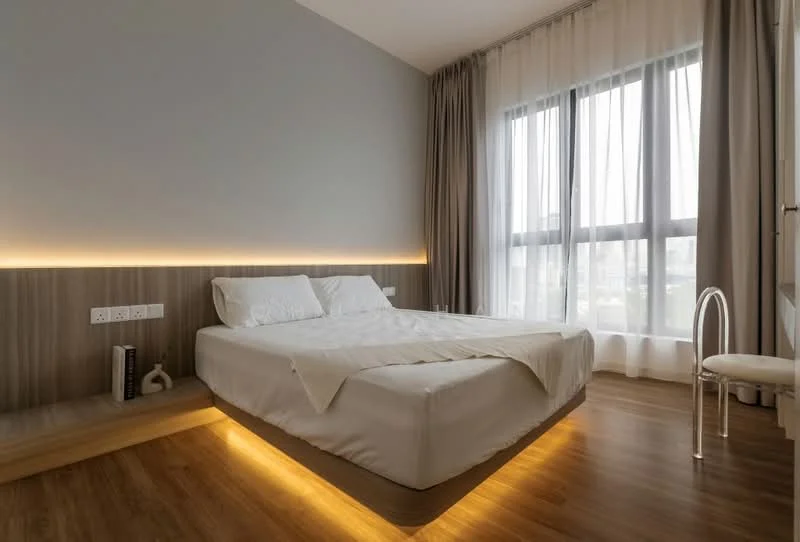 Bedroom features: king-size bed with white bedding, wooden flooring, grey painted walls, floor-to-ceiling windows, sheer curtains, built-in bedside shelf, LED strip lighting under bed, decorative chair, power outlets on wall; style: modern; view: city.