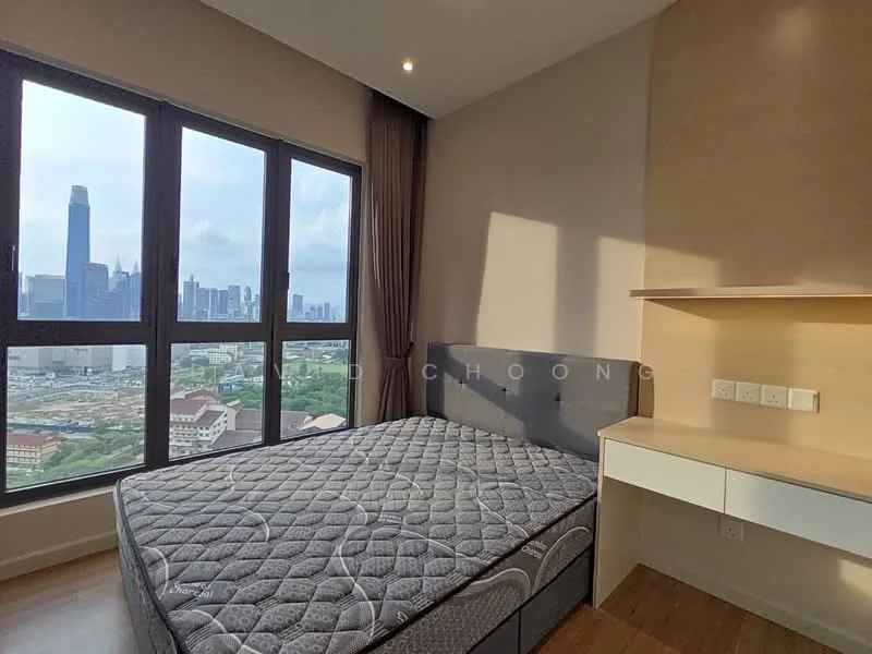 Bedroom features: king-size bed, grey upholstered headboard, floor-to-ceiling windows, city skyline view, wooden flooring, built-in desk with drawers, wall-mounted electrical outlets, curtains, recessed downlights; style: modern; view: city.