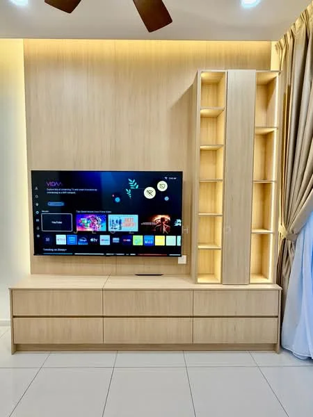 Living features: wall-mounted TV, light wood TV console, built-in shelving unit, recessed lighting, cream-colored walls, white ceiling, ceiling fan, large window with sheer curtains, glossy tile flooring; style: modern.