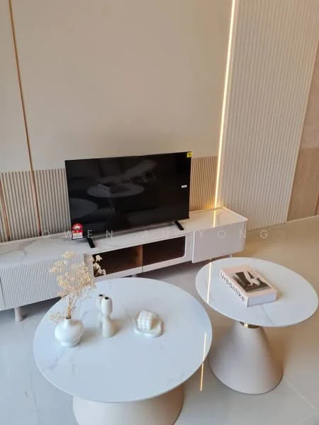 Living features: white marble coffee table, gold base coffee table, TV console with storage, flat-screen TV, decorative vase, decorative sculpture, textured wall panels, light-colored flooring, ambient lighting, minimalist decor; style: modern.