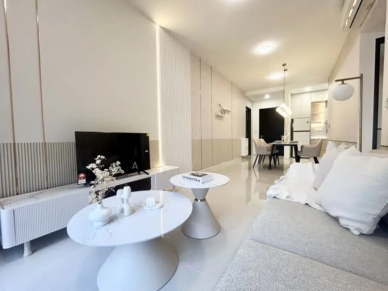 Living features: light grey fabric sofa, white round coffee table, flat-screen TV on white TV console, decorative vase with flowers, white walls, recessed lighting, dining area visible in background, open-plan layout, glossy tile flooring, wall paneling with vertical lines, ceiling-mounted air conditioning unit; style: modern.