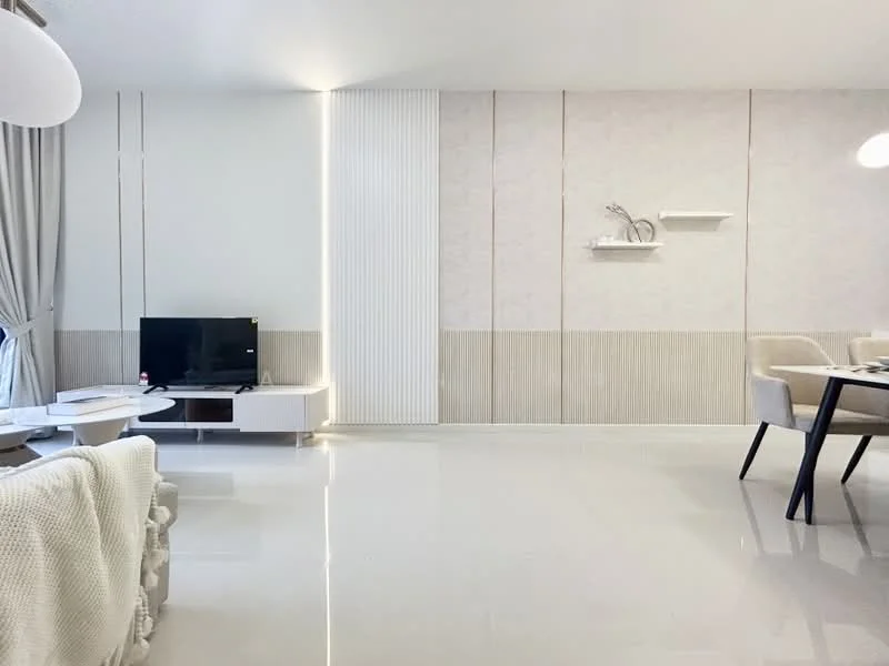 Living features: white painted walls, light grey accent wall, glossy tile flooring, floor-to-ceiling windows, curtains in light grey, TV console in white, black flat-screen TV, decorative shelves, decorative wall art, dining table with black legs, upholstered dining chairs, sofa with throw blanket; style: modern.