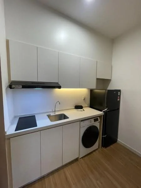Kitchen features: white cabinetry, stainless-steel sink, chrome pull-down faucet, black cooktop, built-in oven, white countertop, front-load washing machine, black refrigerator, wood laminate flooring, recessed LED downlights; style: modern.