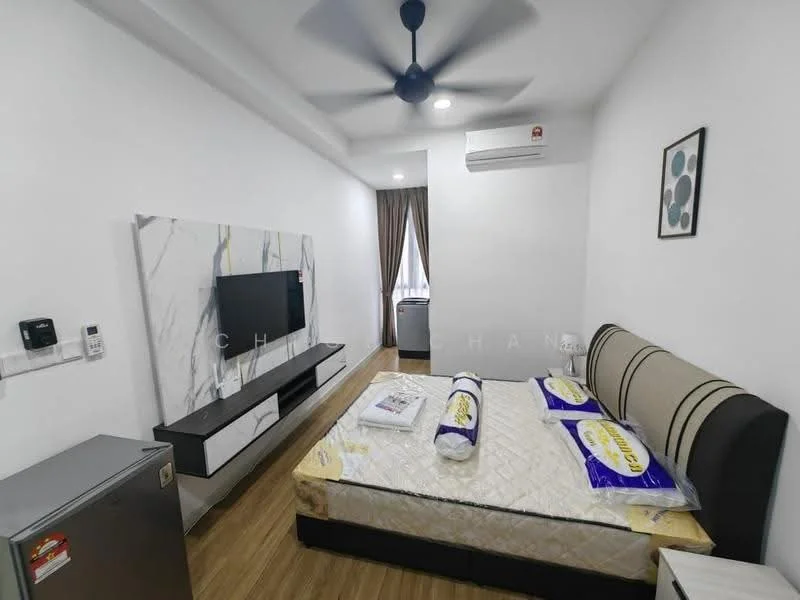 Bedroom features: queen-size bed, upholstered headboard, bedding with decorative pillows, wall-mounted TV, TV console with storage, refrigerator, 5-blade ceiling fan, wall-mounted air conditioning unit, wooden flooring, white painted walls, curtains, decorative wall art; style: modern.