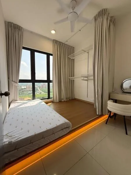 Bedroom features: single bed with white mattress, wooden flooring, white painted walls, floor-to-ceiling windows, sheer curtains, built-in shelving, ceiling fan, LED strip lighting along the base, dressing table with mirror, upholstered chair; style: modern; view: city.