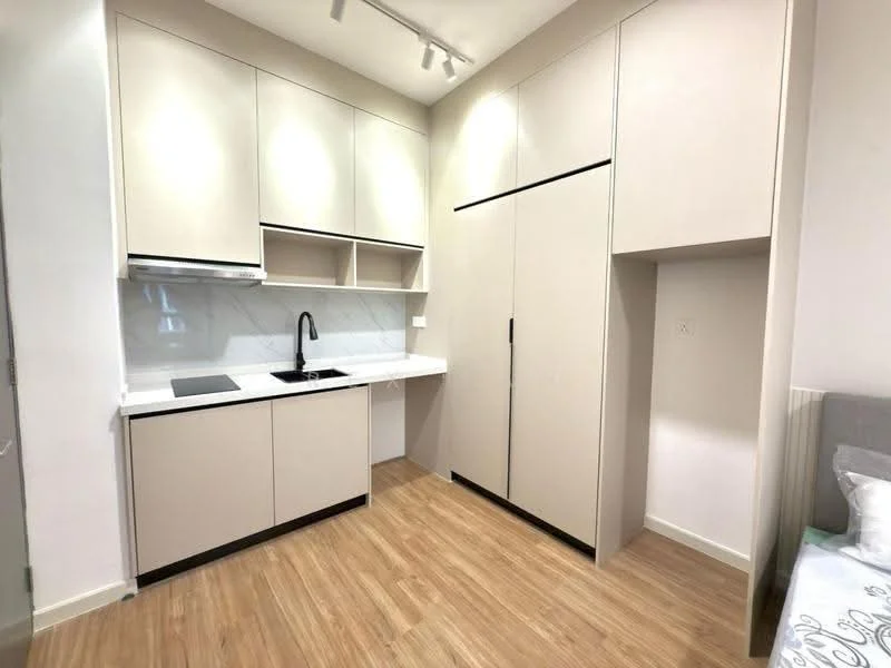 Kitchen features: light beige cabinetry, white marble backsplash, black single-bowl stainless-steel sink, chrome pull-down faucet, built-in refrigerator, built-in oven, induction cooktop, wood laminate flooring, recessed downlights; style: modern.