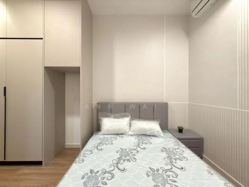 Bedroom features: queen-size bed with grey upholstered headboard, bedding with floral pattern, 2 decorative pillows, nightstand with drawer, built-in wardrobe with sliding doors, light wood flooring, air conditioning unit on wall, wall with vertical paneling, neutral painted walls, small potted plant on nightstand; style: modern.