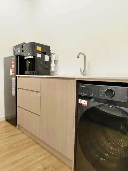 Laundry features: light wood cabinetry, stainless-steel sink with gooseneck faucet, front-load washing machine, fridge, countertop, wood laminate flooring, white walls; style: modern.