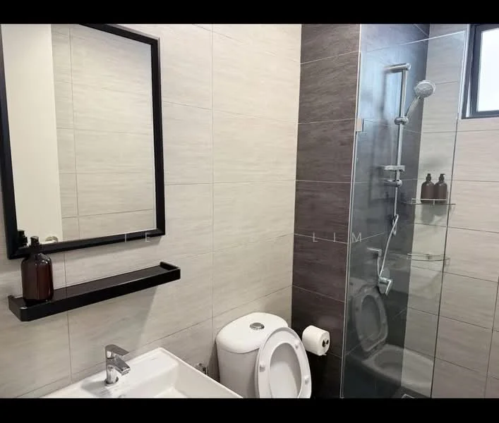 Bathroom features: grey tile cladding on walls, light grey tile flooring, single-sink vanity with white cabinet, chrome basin mixer faucet, framed mirror, walk-in shower with glass enclosure, rain shower head, toilet, shelf above sink, toilet paper holder; style: modern.