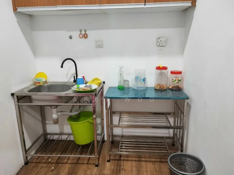 Kitchen features: stainless-steel sink, chrome pull-down faucet, green plastic bucket, clear plastic container with lid, red plastic container, metal shelving unit, wooden countertop, white painted walls, wood cabinetry above sink; style: modern.