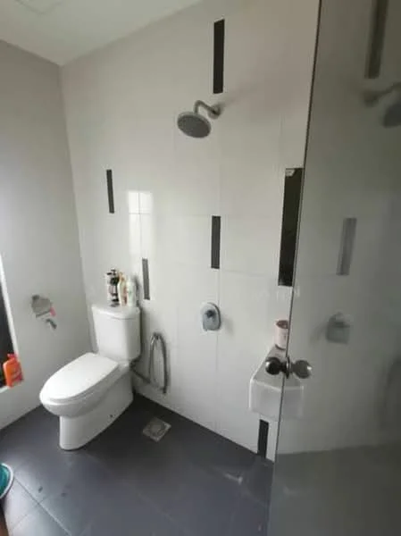 Bathroom features: white one-piece toilet, walk-in shower with glass enclosure, rain shower head, chrome wall-mounted faucet, grey tile flooring, white tiled walls with black accent strips, toilet paper holder, shower caddy, small drain, window for natural light; style: modern.
