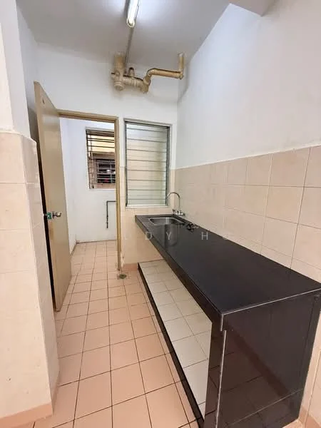 Laundry features: black countertop, single-bowl stainless-steel sink, chrome faucet, wall-mounted pipework, cream tiled walls, light pink tiled flooring, window with metal grille, door leading to another room.