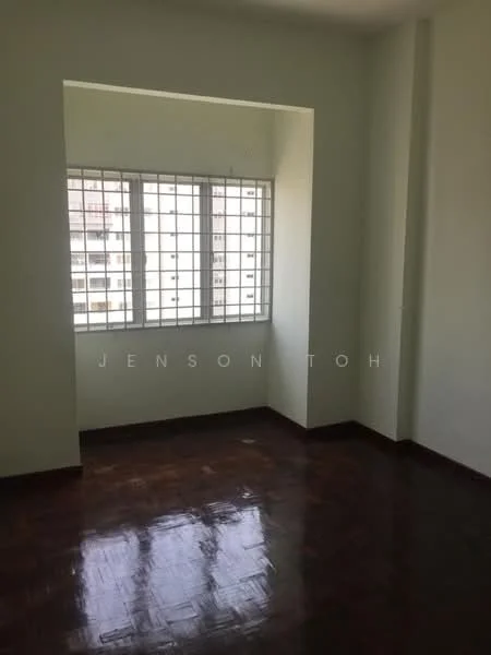 Room features: light green painted walls, dark wood flooring, square window with metal grille, natural light from window, corner nook, no visible furniture, plain ceiling, no visible decor; style: minimalist.