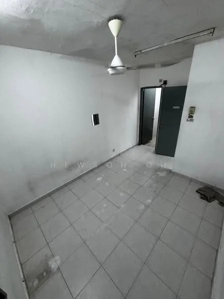 Room features: white painted walls, grey tiled flooring, ceiling fan, single door, light fixture, wall-mounted electrical panel, window, corner space.
