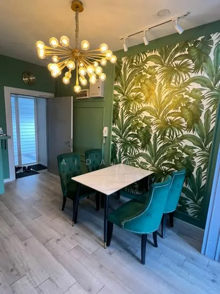 Dining features: green painted walls, feature wall with tropical leaf pattern, white marble dining table, 4 upholstered dining chairs in green, chandelier with multiple bulbs, wooden flooring, wall-mounted air conditioning unit, sliding door leading to outside; style: modern.