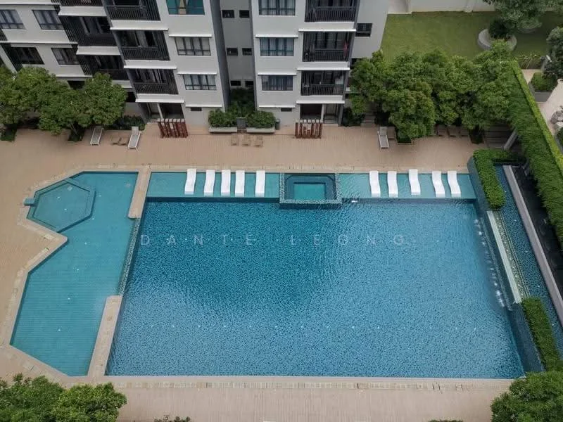 Exterior type: high-rise condominium; features: infinity pool, lap pool, pool deck with loungers, landscaped garden, manicured lawn, surrounded by greenery; style: modern.