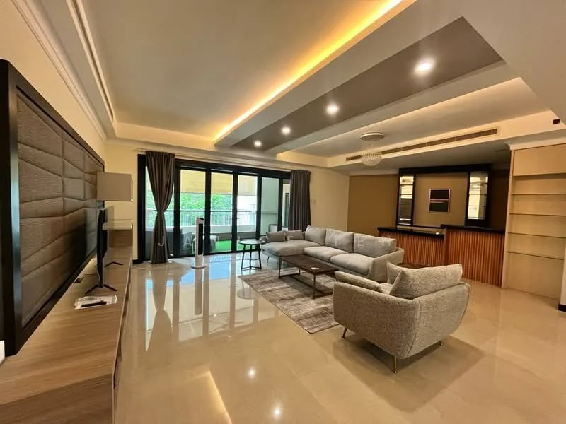 Living features: grey fabric L-shape sectional sofa, 3-seater fabric sofa in light grey, coffee table, TV console, wall-mounted TV, area rug with geometric pattern, recessed LED downlights, crown moulding, floor-to-ceiling windows, sliding glass door, sheer curtains, built-in shelving, bar counter with wooden finish, marble flooring; style: modern; view: garden.