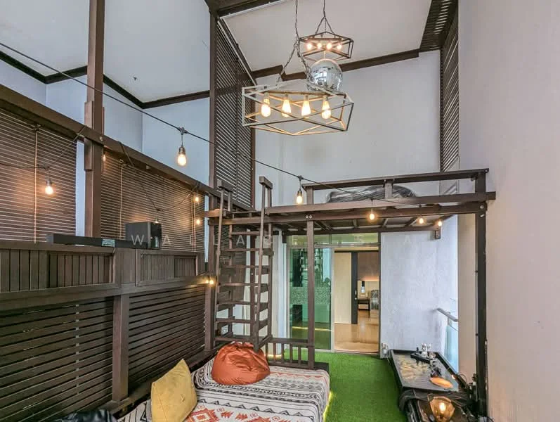 Living features: wooden flooring, white painted walls, exposed wooden beams, hanging pendant light fixture, string lights, lofted sleeping area, staircase leading to loft, sofa with decorative cushions, green carpet, large glass door, decorative wall art; style: modern.