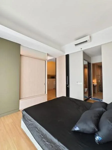Bedroom features: queen-size bed with black bedding, two black pillows, wooden flooring, wall-mounted split AC, built-in wardrobe with sliding doors, green accent wall, neutral painted walls, floor-to-ceiling windows, natural light from window, decorative wall paneling; style: modern.