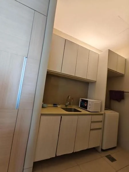 Kitchen features: light wood cabinetry, single-bowl stainless-steel sink, chrome faucet, microwave, built-in washing machine, countertop with light-colored surface, tile flooring, wall-mounted storage, under-cabinet lighting; style: modern.