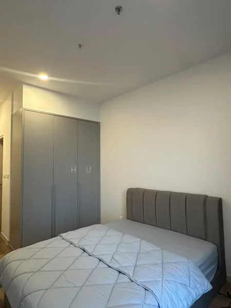 Bedroom features: queen-size bed, upholstered headboard, grey bedding, built-in wardrobe with sliding doors, white painted walls, wooden flooring, ceiling light fixture; style: modern.