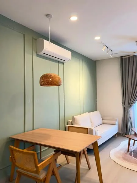 Living features: light green painted walls, wooden flooring, sofa in white fabric, wooden dining table, wooden dining chair, pendant light fixture, wall-mounted split AC, curtains in grey fabric, recessed LED downlights, area rug in circular shape; style: modern.