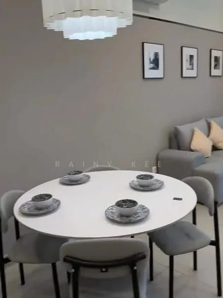 Dining features: round dining table, white tabletop, 4 upholstered dining chairs in grey, decorative plates on table, pendant light fixture, grey painted walls, framed artwork on walls, sofa in background with cushions; style: modern.