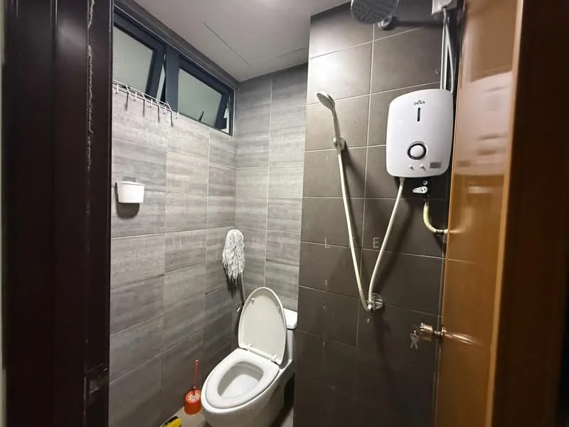 Bathroom features: one-piece toilet, shower with handheld showerhead, wall-mounted water heater, grey tiled walls, dark grey tiled flooring, small wall-mounted shelf, towel rack, cleaning supplies, window for natural light; style: modern.