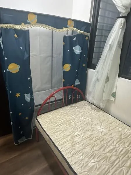 Bedroom features: single bed frame in red, mattress on bed frame, curtains with space-themed design, white sheer curtains, wooden flooring, window with grille, decorative wall panel, wall with dark finish.