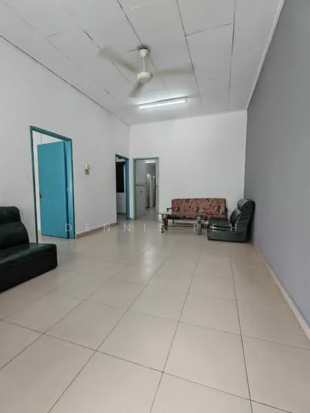 Living features: white painted walls, grey accent wall, tile flooring, 5-blade ceiling fan, 2 black leather sofas, floral patterned sofa, glass coffee table, blue door, refrigerator visible in background.