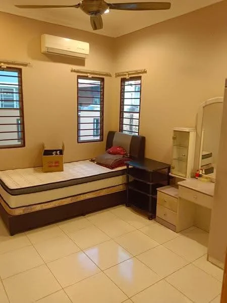 Bedroom features: single bed with mattress, wooden headboard, 2 bedside tables, dressing table with mirror, ceiling fan, wall-mounted split AC, white painted walls, tile flooring, 2 windows with horizontal bars, box on bed.